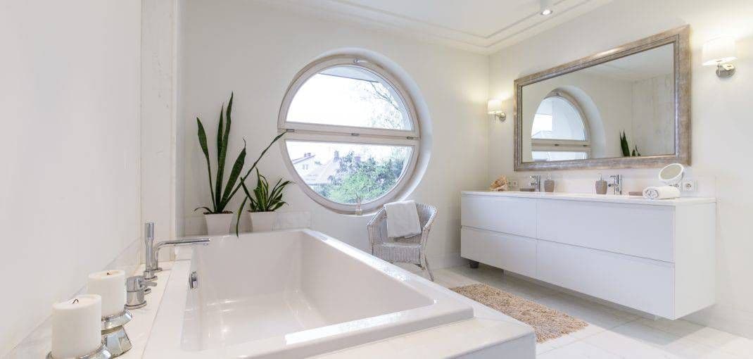 minimalist-white-bathroom-with-a-circulal-window